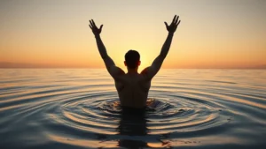Person emerging from water at sunrise, arms raised in triumph and liberation, golden light reflecting off ripples, symbolizing breakthrough and emergence into new possibilities, photorealistic, serene natural setting