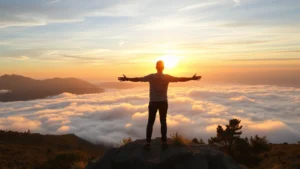 Person standing confidently on a mountain peak at sunrise, arms slightly open, looking toward horizon with peaceful expression, golden light surrounding them, nature backdrop with clouds below